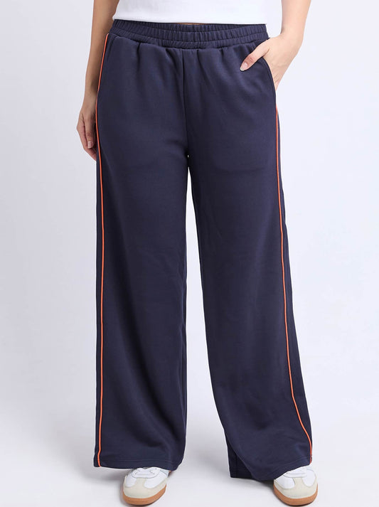 Image of a model wearing Pants. Product name - Foxwood Traveller Pant in Navy Orange colour by brand - Foxwood