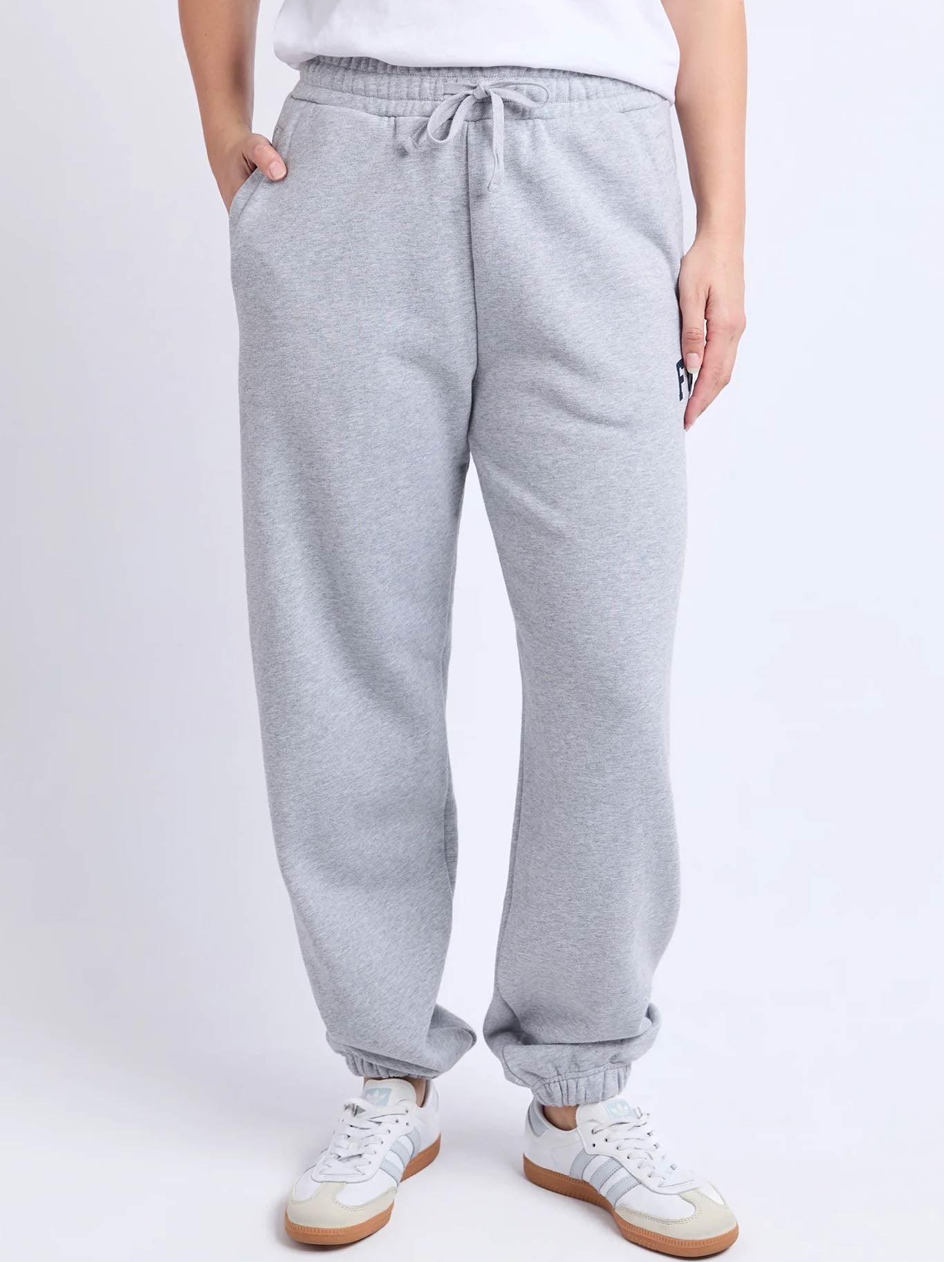 Image of a model wearing Pants. Product name - Foxwood Intention Pant in Grey Na Vy colour by brand - Foxwood