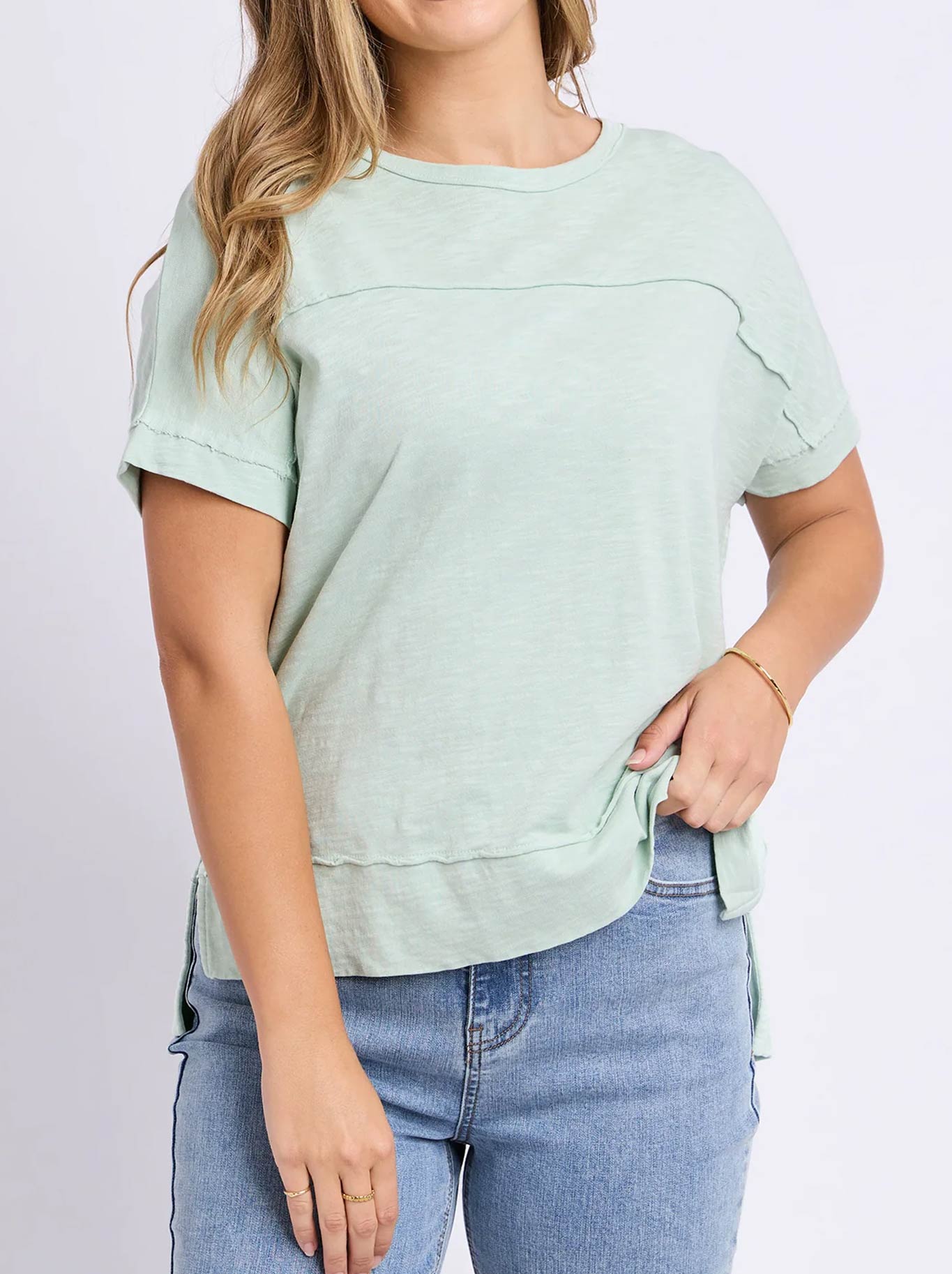 Image of a model wearing Tops. Product name - FOXWOOD ALLISON TEE in Subdued Mint colour by brand - Foxwood