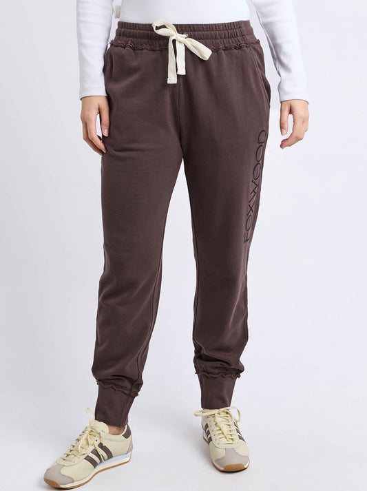 Image of a model wearing Pants. Product name - Foxwood Simplified Trackpant in Coffee colour by brand - Foxwood