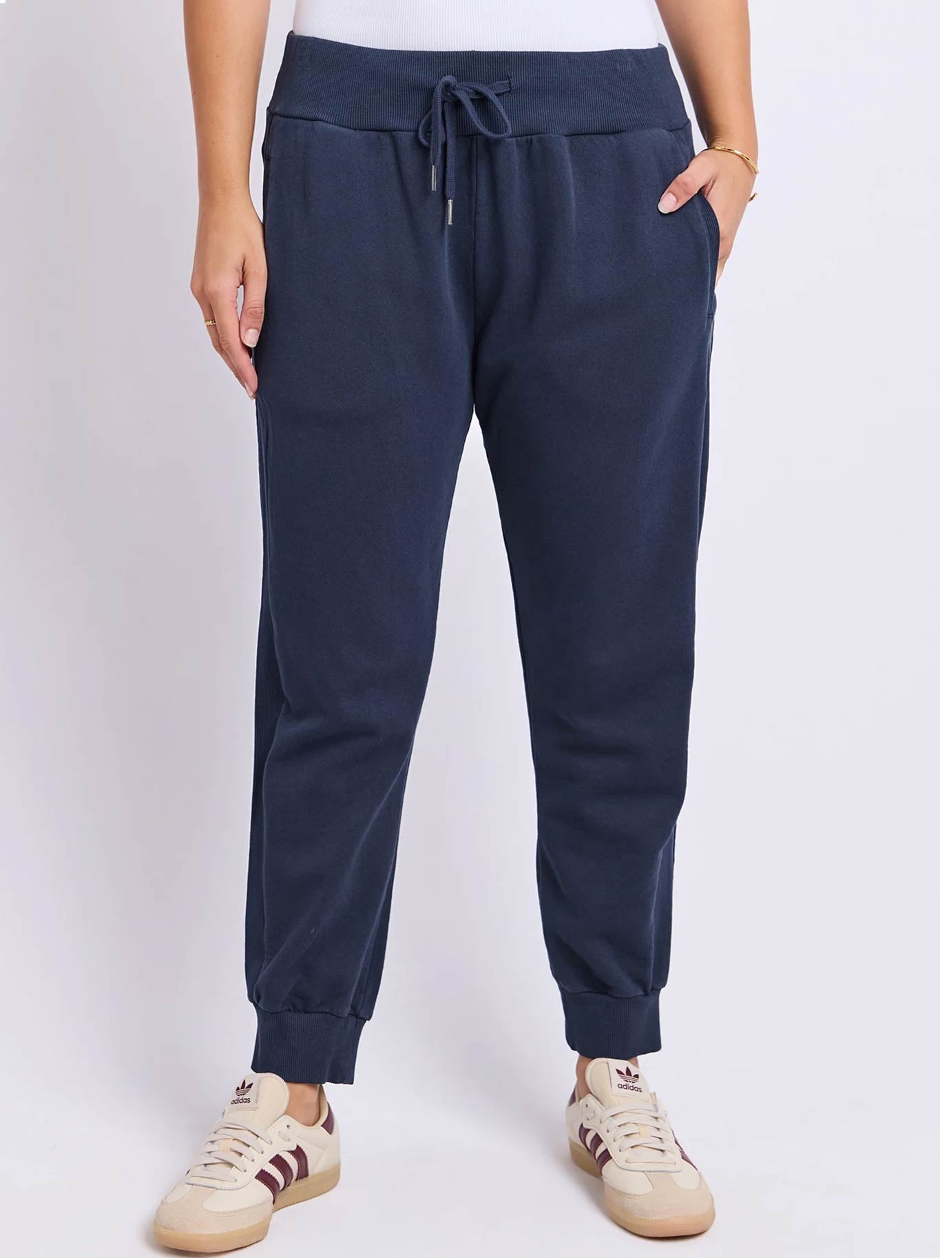 Image of a model wearing Pants. Product name - FOXWOOD SAMI TRACKPANT in Dark Sapphire colour by brand - Foxwood
