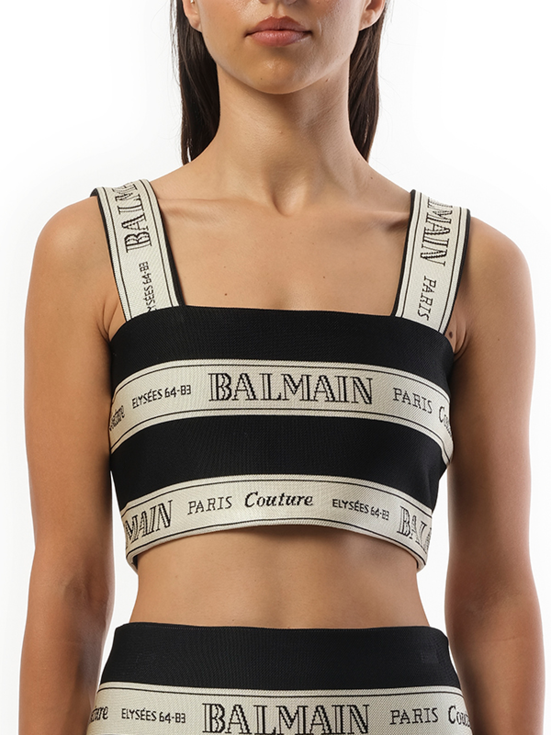 Image of a model wearing Tops. Productname: BALMAIN Striped Balmain Jacquard Crop Top in Black Beige colour by brand - BALMAIN