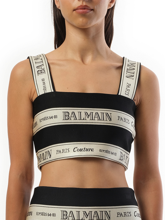Image of a model wearing Tops. Productname: BALMAIN Striped Balmain Jacquard Crop Top in Black Beige colour by brand - BALMAIN
