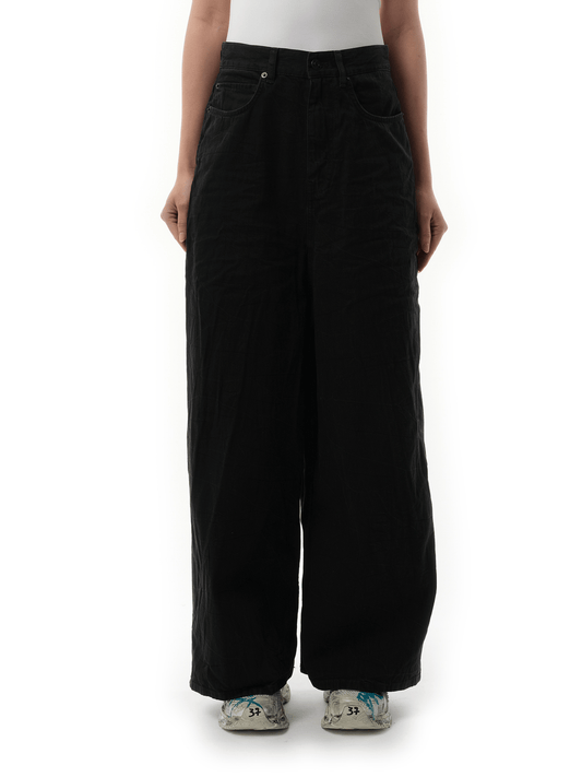 Image of a model wearing Denim. Productname: BALENCIAGA Low Crotch Japanese Denim Jeans in Black colour by brand - BALENCIAGA