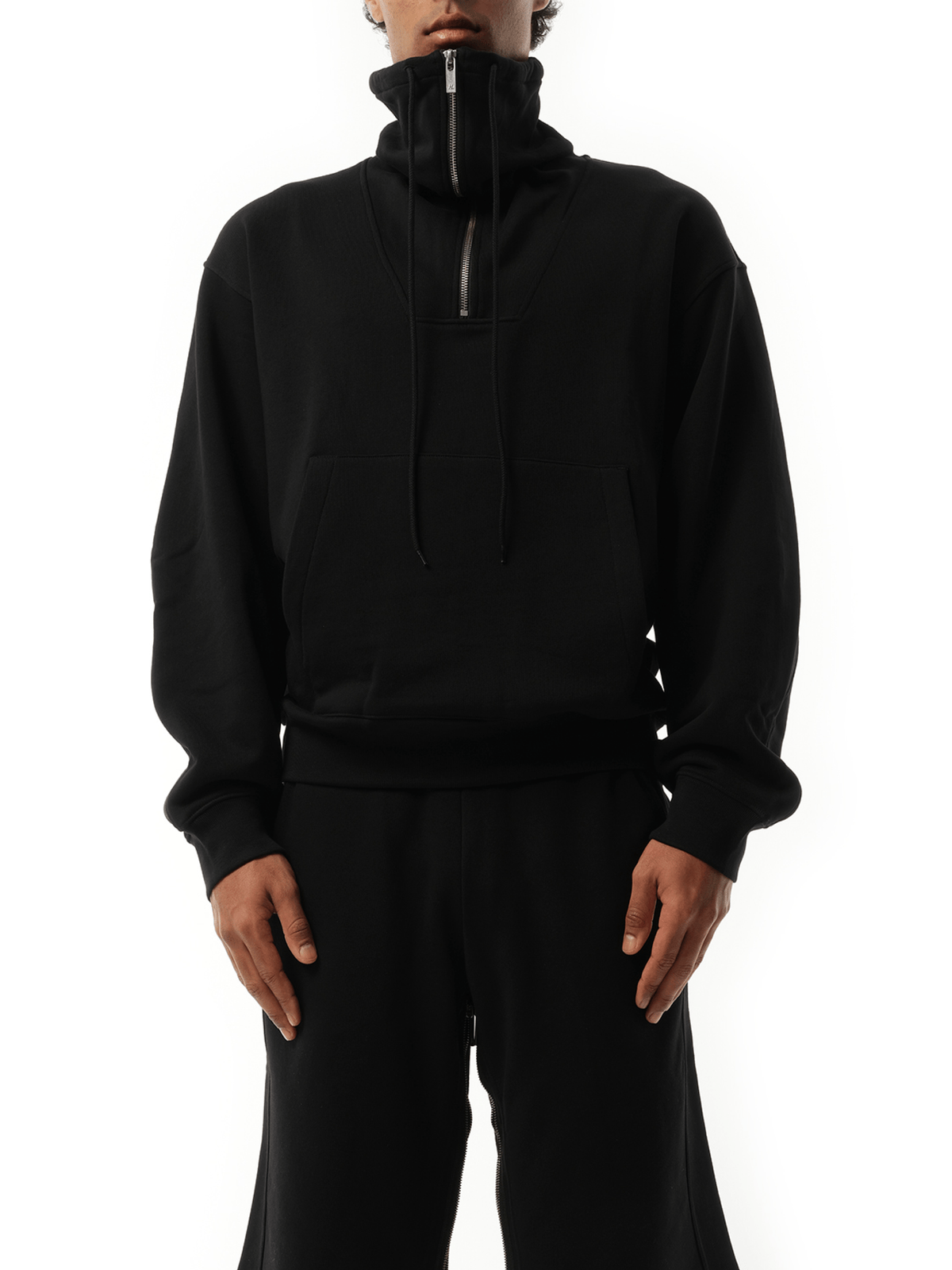 Image of a model wearing Outerwear. Product name - Funnel Neck Sweatshirt in Black colour by brand - HELMUT LANG