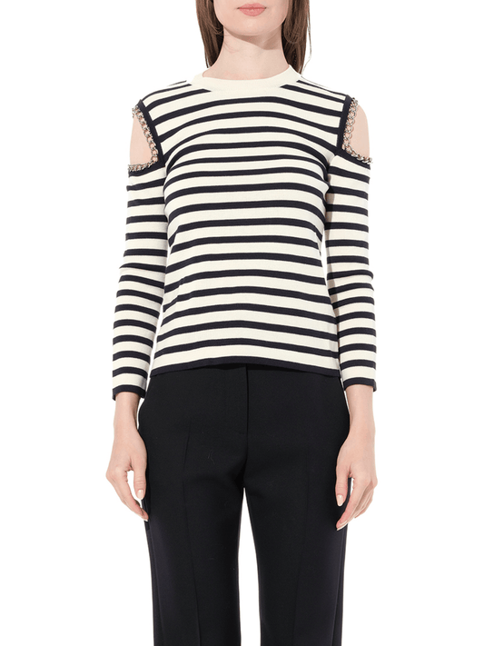 Image of a model wearing Outerwear. Productname: ALEXANDER MCQUEEN Crew Neck Knitwear Ivory in WHITE colour by brand - ALEXANDER MCQUEEN