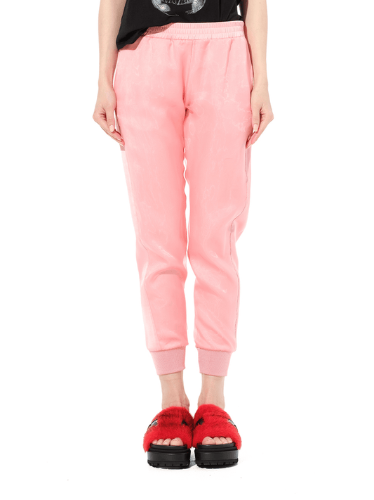Image of a model wearing Pants. Productname: ALEXANDER MCQUEEN Satin Organza Jogger in Anemone colour by brand - ALEXANDER MCQUEEN
