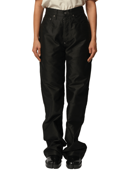 Image of a model wearing Pants. Productname: MAISON MARGIELA Cotton Satin 5 Pocket Pants in Black colour by brand - MAISON MARGIELA