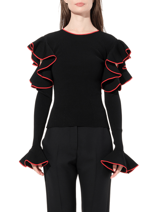Image of a model wearing Outerwear. Productname: ALEXANDER MCQUEEN Longsleeve Knitwear in Black colour by brand - ALEXANDER MCQUEEN