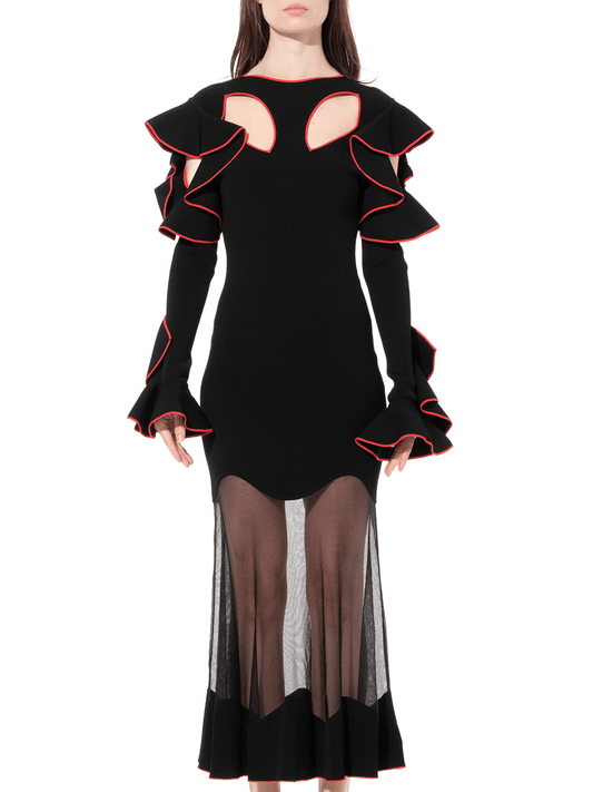 Image of a model wearing Dress. Productname: ALEXANDER MCQUEEN Long Sleeve Knit Dress in Black colour by brand - ALEXANDER MCQUEEN
