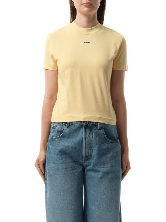 Image of a model wearing Tops. Productname: JACQUEMUS Le T-Shirt Gros Grain in BEIGE colour by brand - JACQUEMUS