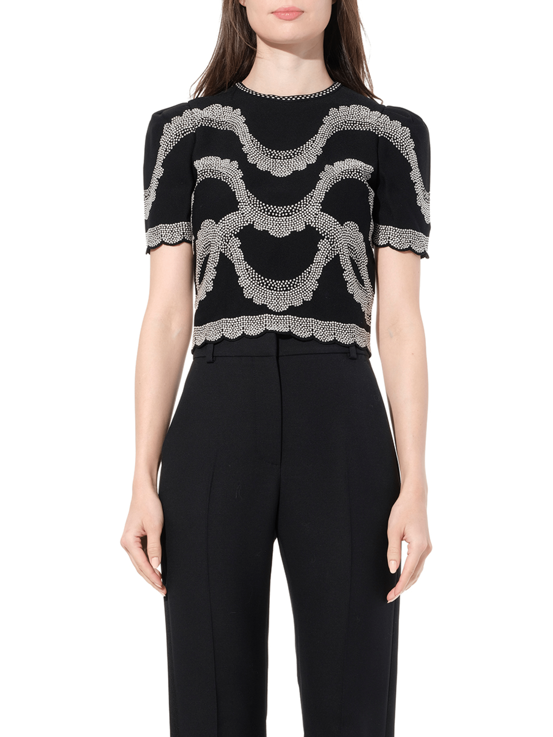 Image of a model wearing Shorts. Productname: ALEXANDER MCQUEEN Short Sleeve Top in Black colour by brand - ALEXANDER MCQUEEN