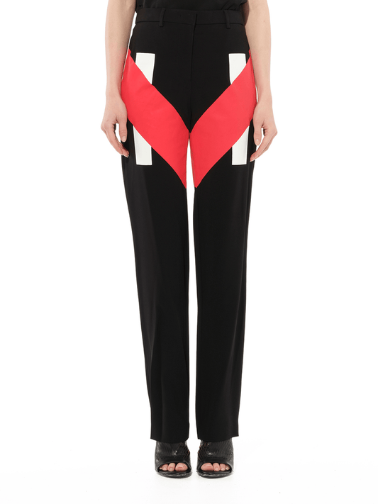 Image of a model wearing Pants. Productname: GIVENCHY Pants in Black Red colour by brand - GIVENCHY