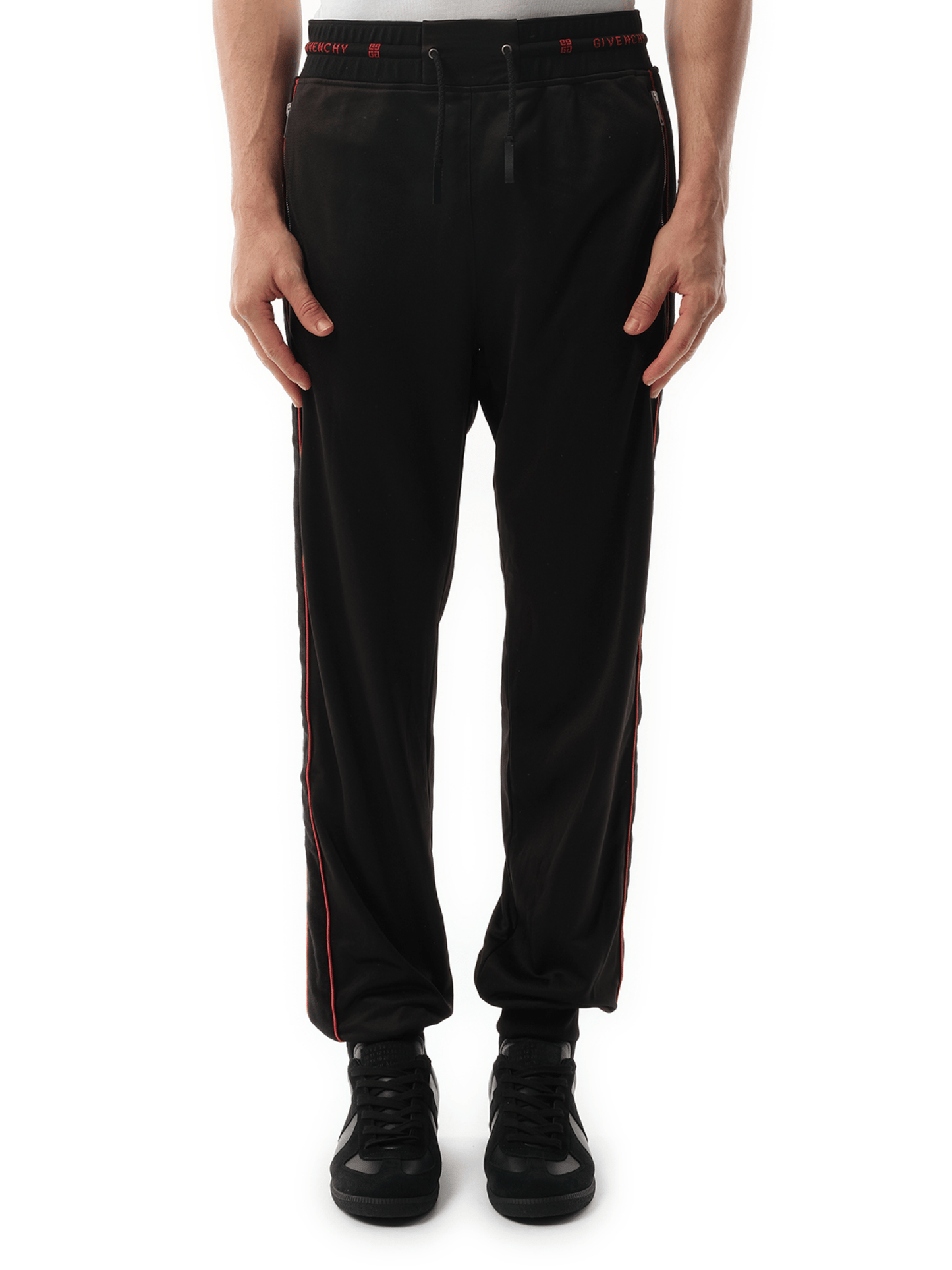 Image of a model wearing Pants. Product name - Jogging Pants Black in Black colour by brand - GIVENCHY