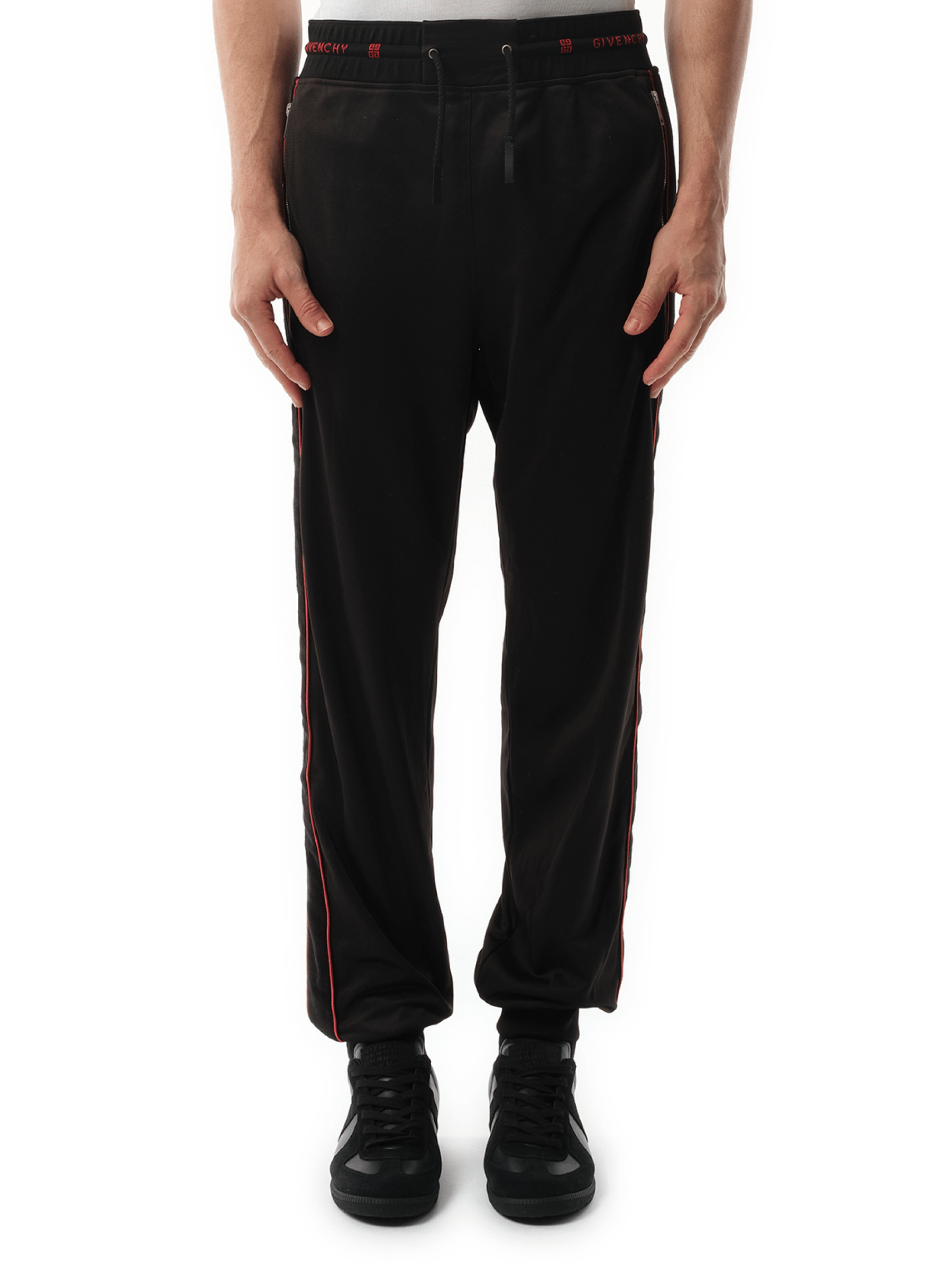 Image of a model wearing Pants. Product name - Jogging Pants Black in Black colour by brand - GIVENCHY
