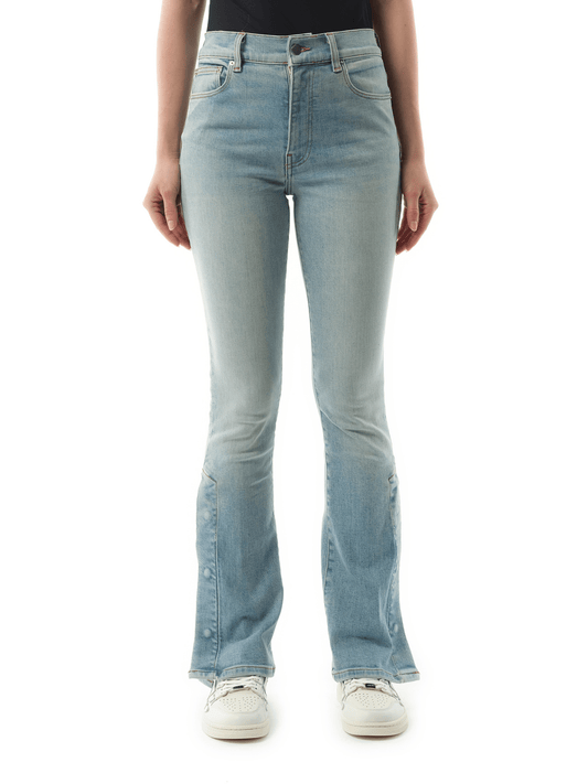 Image of a model wearing Denim. Productname: AMIRI Kick Flare Jeans in Clay Indigo colour by brand - AMIRI