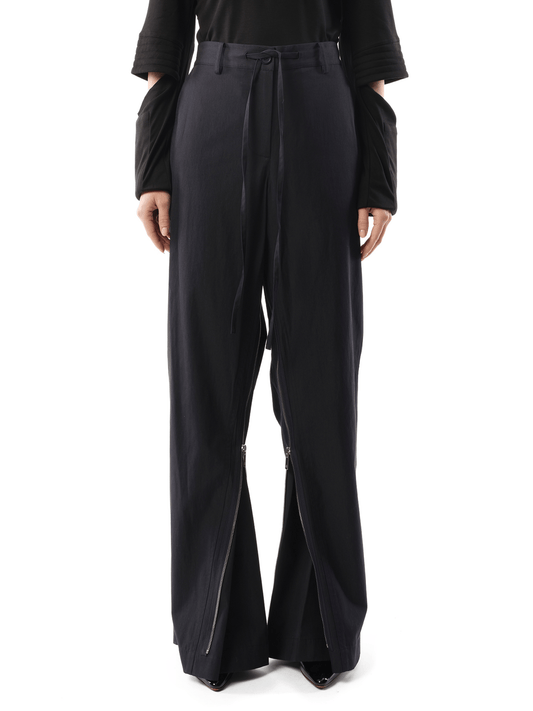 Image of a model wearing Pants. Productname: HELMUT LANG Gusset Wide Leg Pants in Navy colour by brand - HELMUT LANG