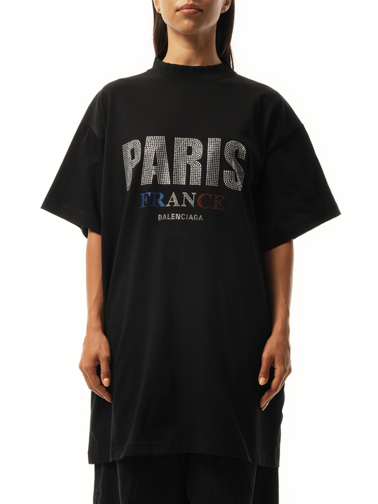 Image of a model wearing Tops. Productname: BALENCIAGA Paris Strass Oversized T-Shirt in Black colour by brand - BALENCIAGA