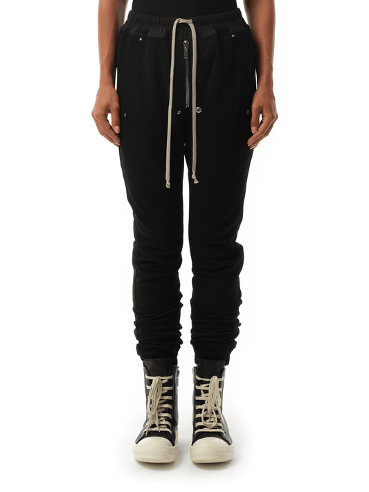 Image of a model wearing Pants. Productname: RICK OWENS Bela Jogger Pants in Black colour by brand - RICK OWENS