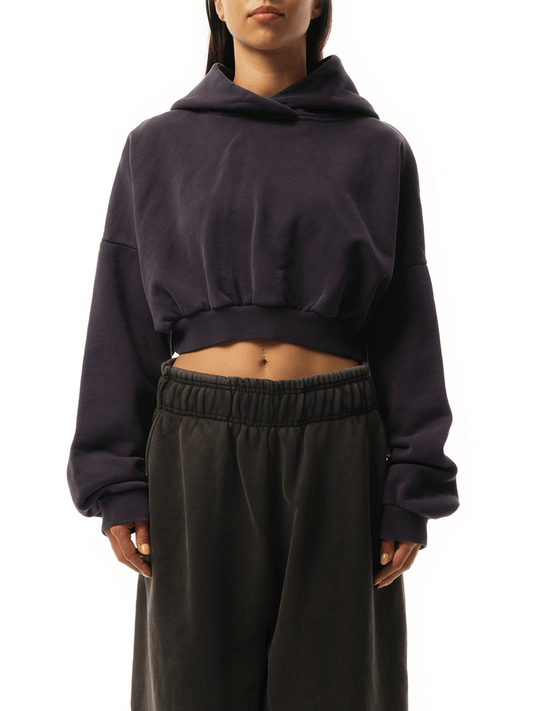 Image of a model wearing Outerwear. Product name - Cropped Heavy Hood in Purple colour by brand - ENTIRE STUDIOS
