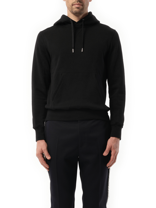 Image of a model wearing Outerwear. Productname: ALEXANDER MCQUEEN Organic B Sweatshirt in BLACK colour by brand - ALEXANDER MCQUEEN