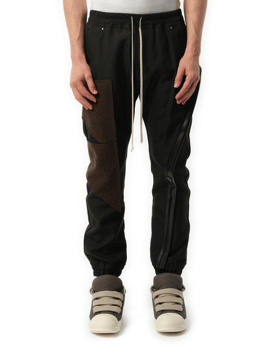 Image of a model wearing Pants. Productname: RICK OWENS Mastodon Megacargo Pants in BLACK colour by brand - RICK OWENS