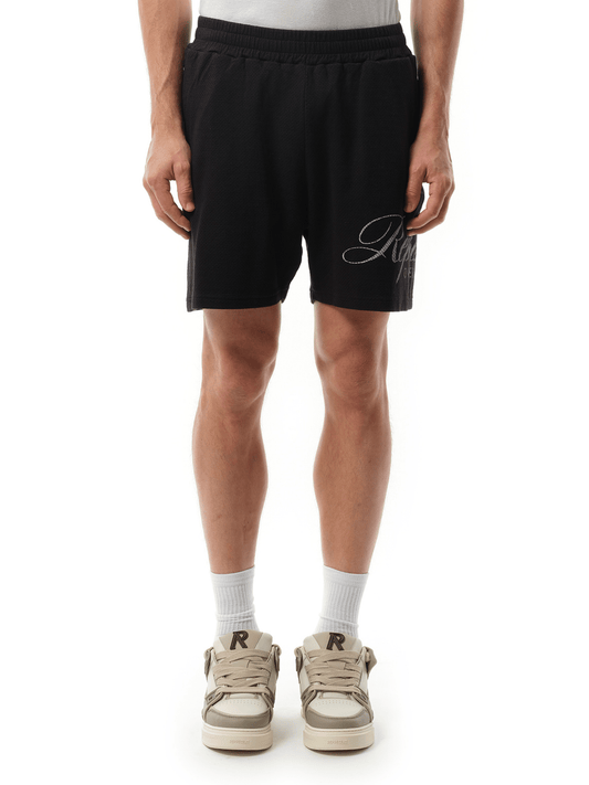 Image of a model wearing Shorts. Productname: Represent Owners Club Script Mesh Shorts in Black colour by brand - REPRESENT