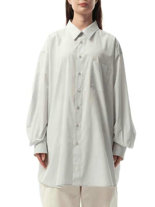 Image of a model wearing Tops. Productname: MAISON MARGIELA Long-sleeved Shirt in Light Blue colour by brand - MAISON MARGIELA