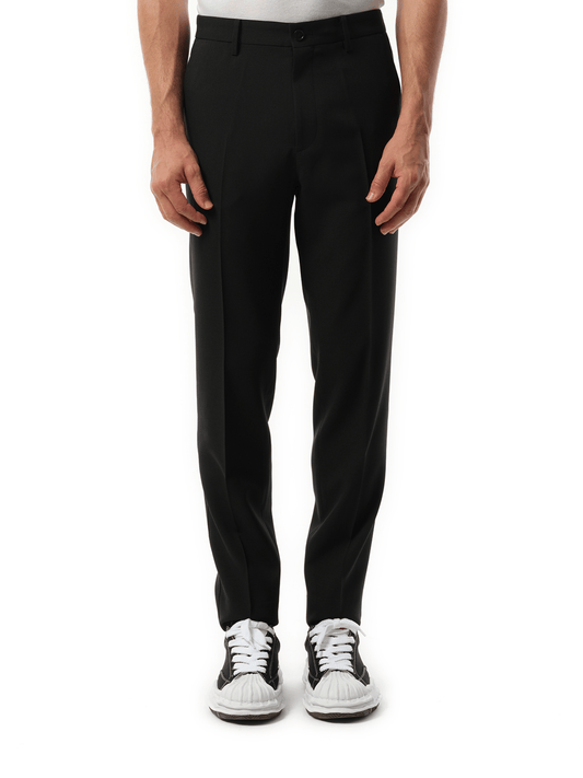Image of a model wearing Pants. Productname: UNDERCOVER Zip Detail Casual Pants in BLACK colour by brand - UNDERCOVER