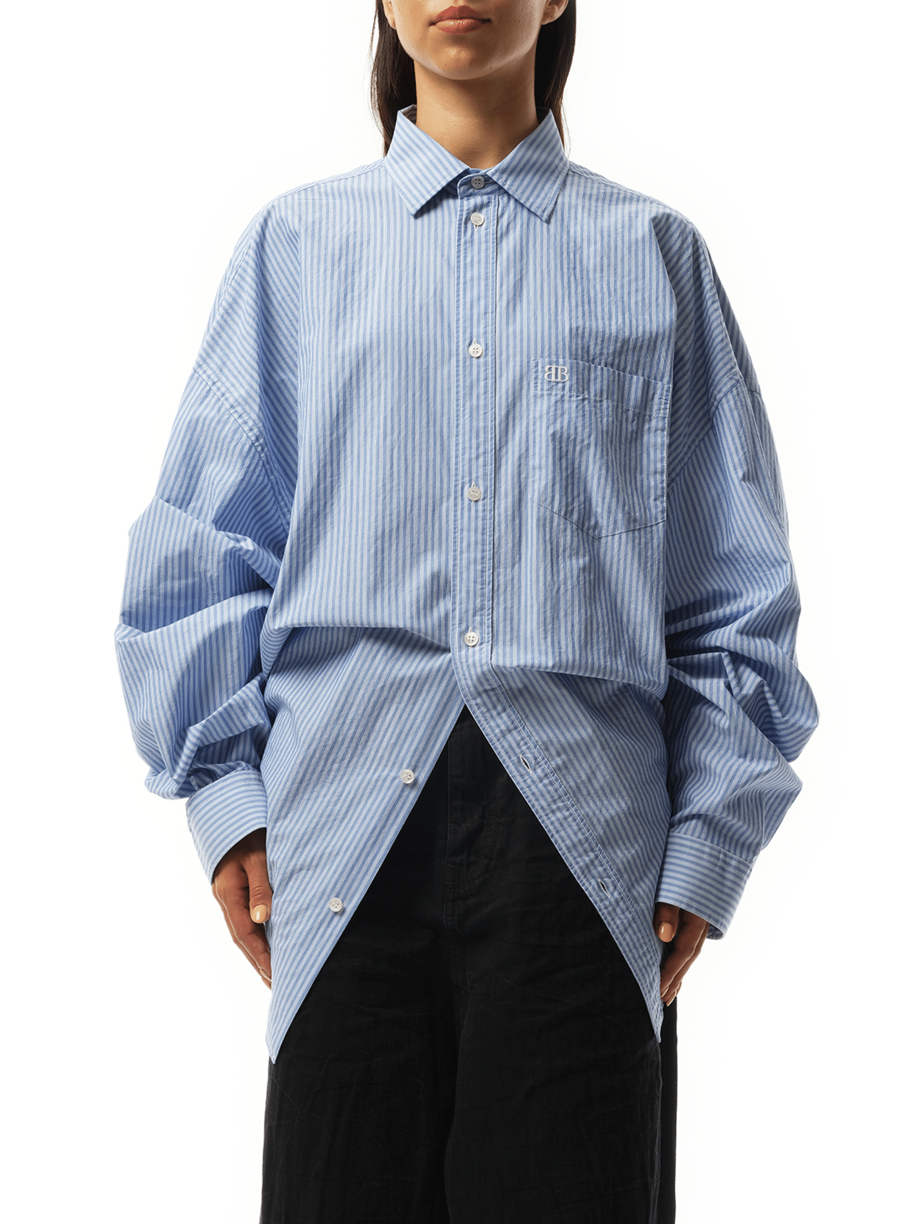 Image of a model wearing Tops. Productname: BALENCIAGA Long Sleeve Knotted Shirt in Blue White colour by brand - BALENCIAGA
