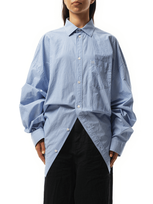 Image of a model wearing Tops. Productname: BALENCIAGA Long Sleeve Knotted Shirt in Blue White colour by brand - BALENCIAGA