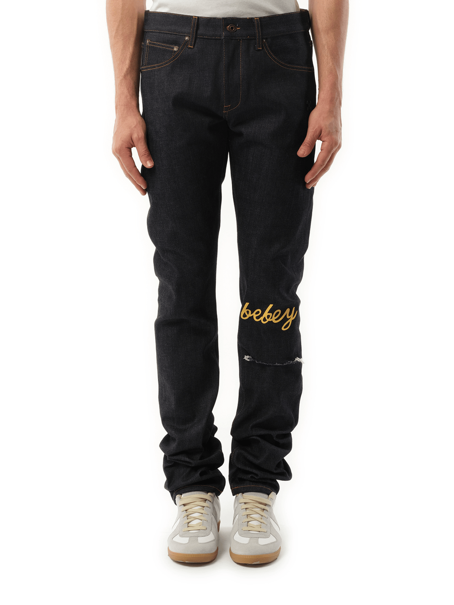 Image of a model wearing Denim. Productname: OFF-WHITE THL Bebey Arrow Selvedge Jeans in BLUE colour by brand - OFF-WHITE