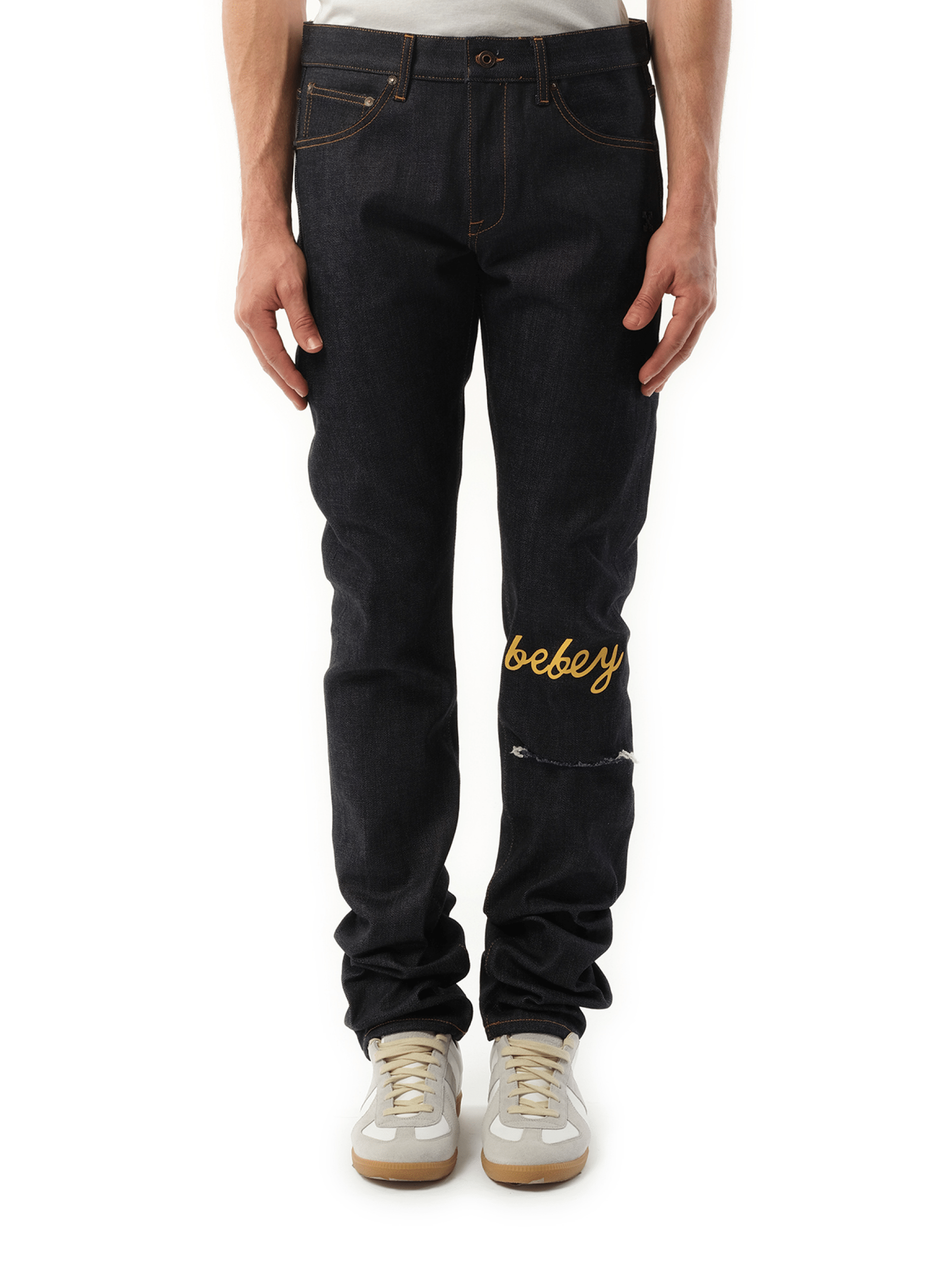 Image of a model wearing Denim. Productname: OFF-WHITE THL Bebey Arrow Selvedge Jeans in BLUE colour by brand - OFF-WHITE
