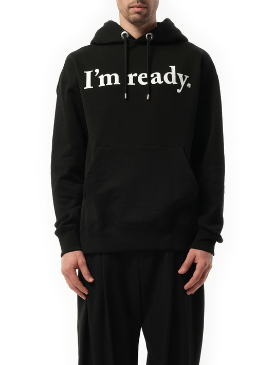 Image of a model wearing Outerwear. Product name - Hoodie in Black colour by brand - MASTERMIND