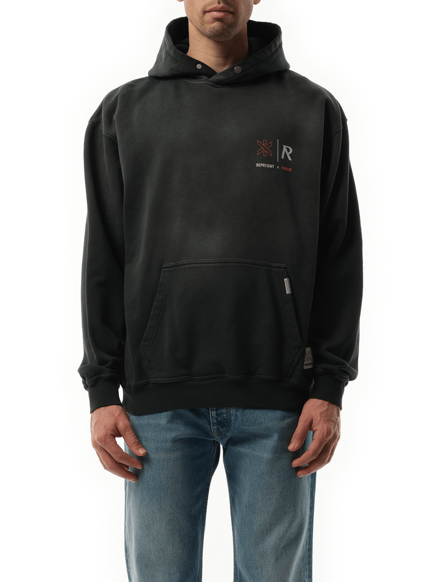 Image of a model wearing Outerwear. Product name - Represent x Marais Logo Lock Up Hoodie in Black colour by brand - REPRESENT