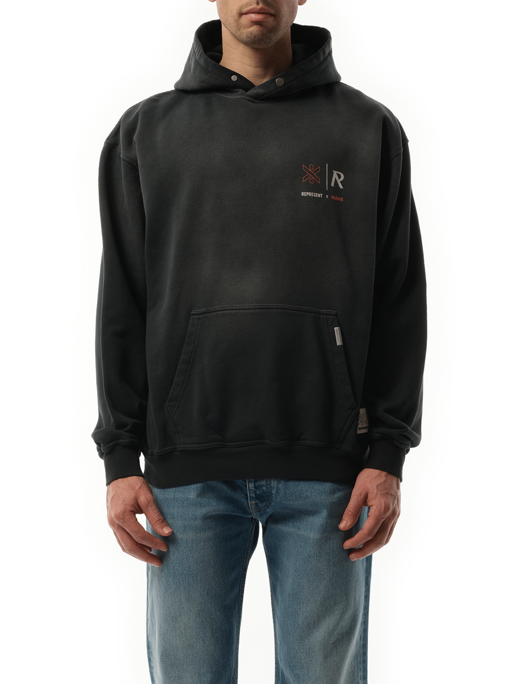 Image of a model wearing Outerwear. Product name - Represent x Marais Logo Lock Up Hoodie in Black colour by brand - REPRESENT