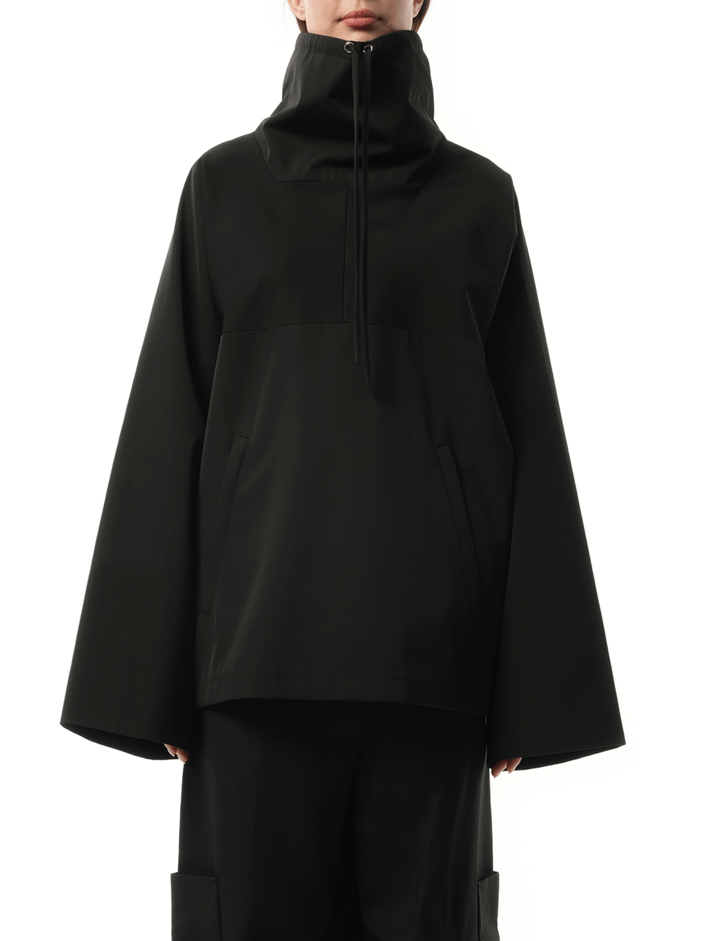 Image of a model wearing Outerwear. Productname: KHAITE Paulson Jacket in Black colour by brand - KHAITE