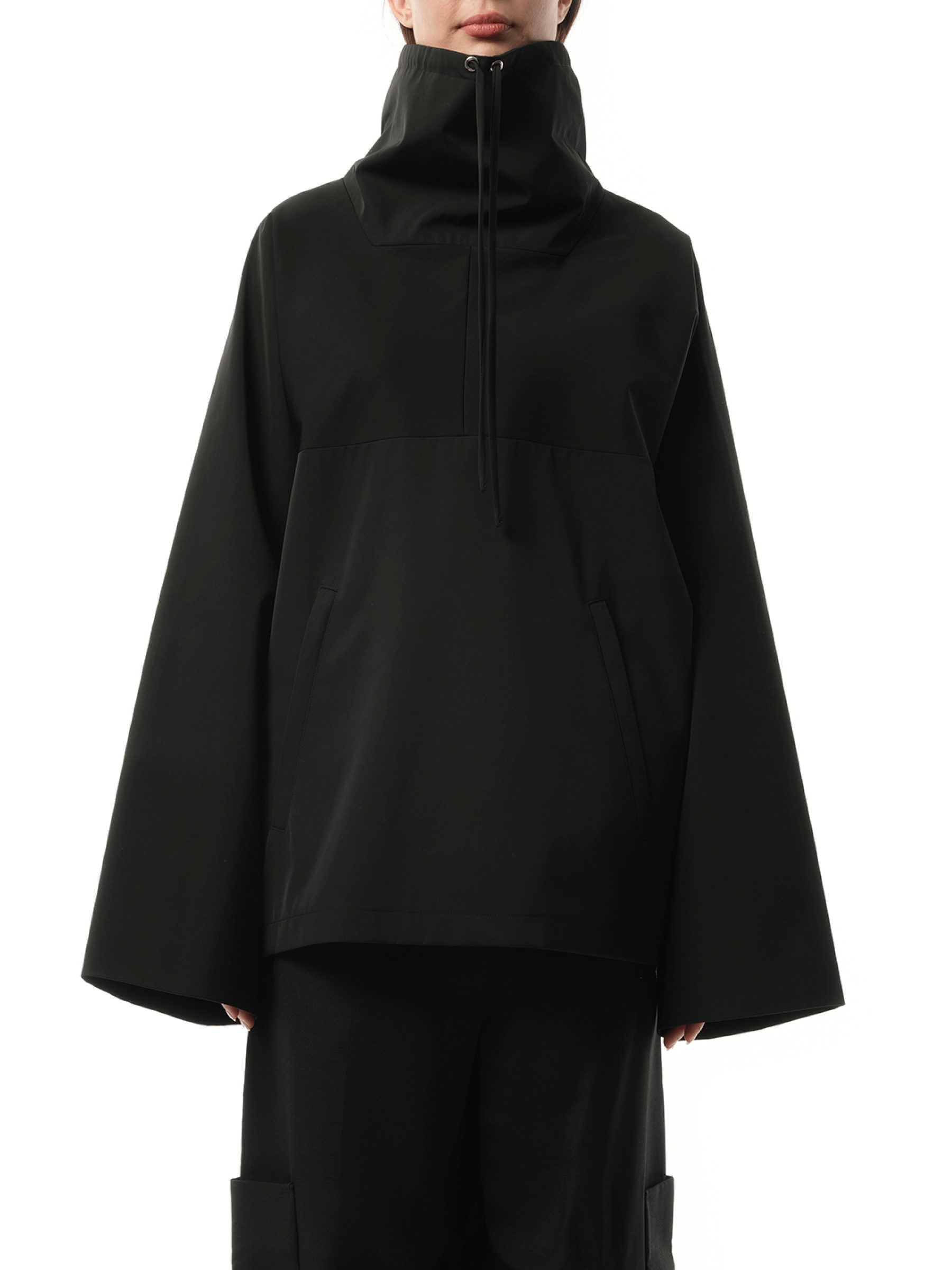 Image of a model wearing Outerwear. Productname: KHAITE Paulson Jacket in Black colour by brand - KHAITE