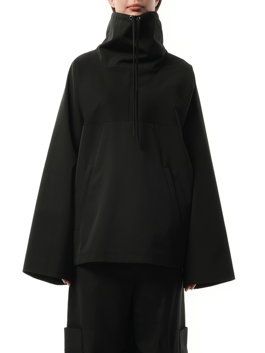 Image of a model wearing Outerwear. Productname: KHAITE Paulson Jacket in Black colour by brand - KHAITE