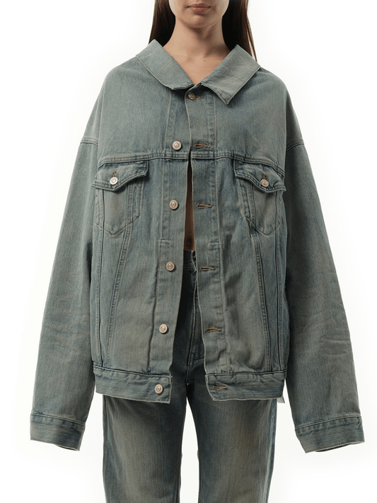 Image of a model wearing Denim. Productname: BALENCIAGA Off Shoulder Selvedge Denim Jacket in Blue colour by brand - BALENCIAGA