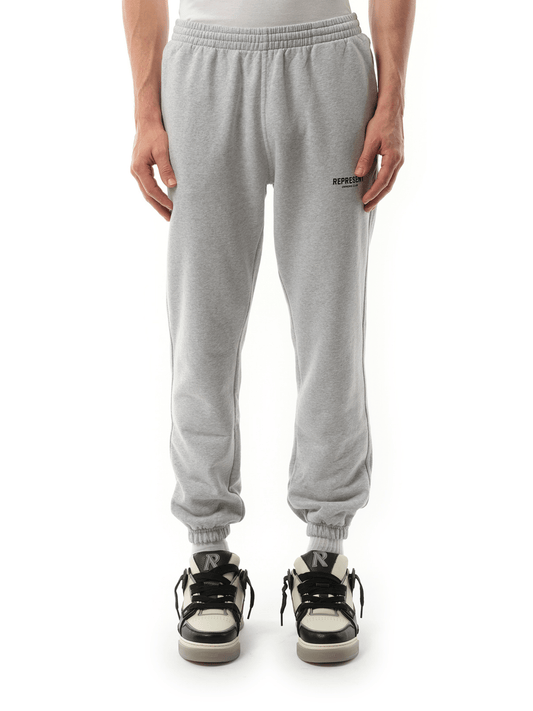 Image of a model wearing Pants. Product name - Represent Owners Club Sweatpants in Grey colour by brand - REPRESENT