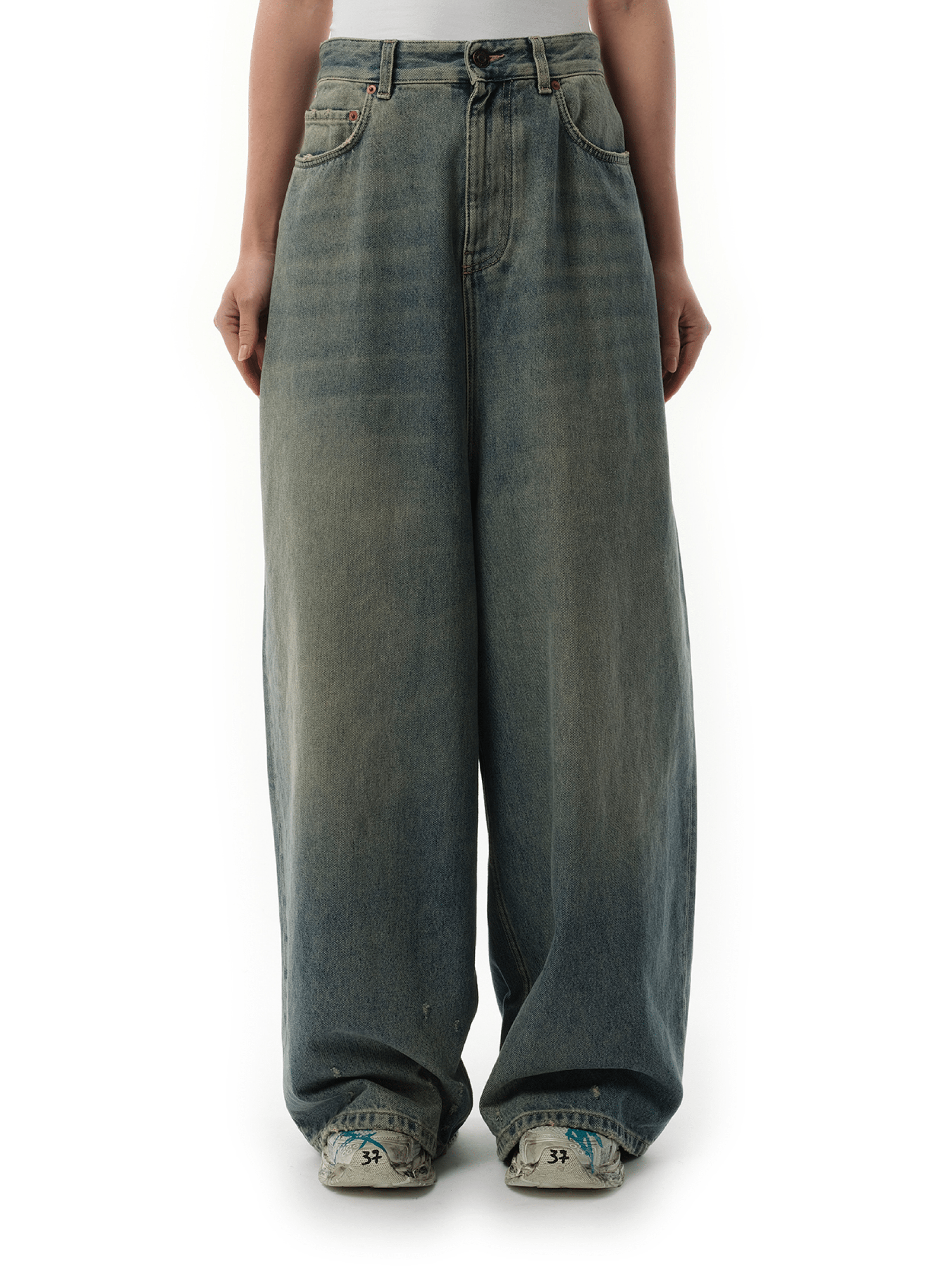 Image of a model wearing Denim. Productname: BALENCIAGA Low Crotch Jeans in Blue Rust colour by brand - BALENCIAGA