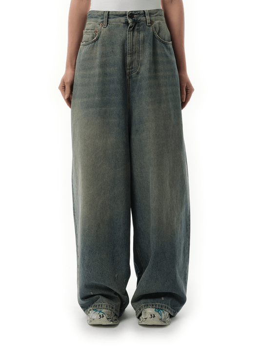 Image of a model wearing Denim. Productname: BALENCIAGA Low Crotch Jeans in Blue Rust colour by brand - BALENCIAGA