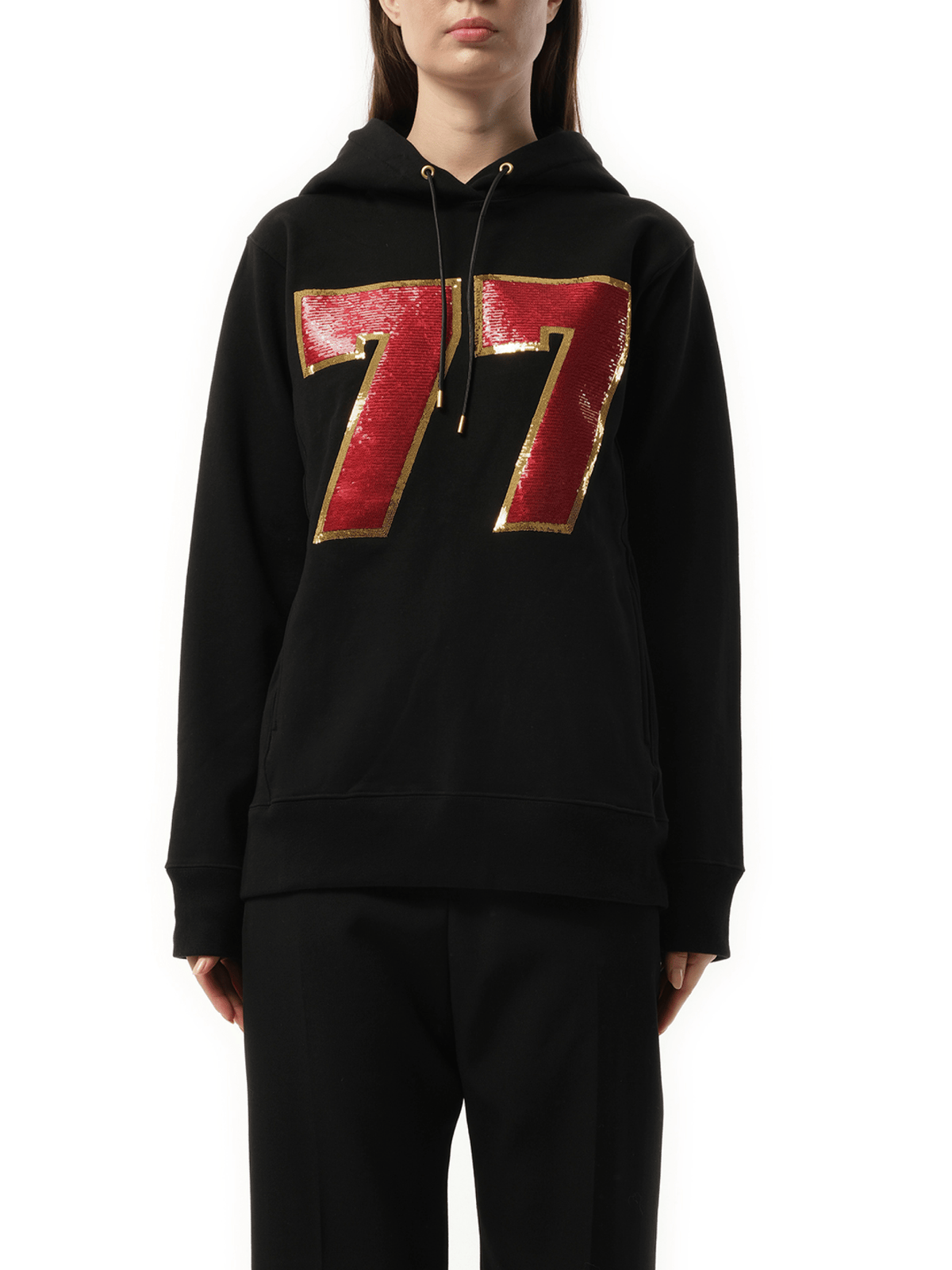 Image of a model wearing Outerwear. Product name - Hoodie in Black colour by brand - MASTERMIND