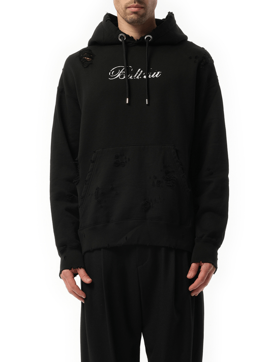 Image of a model wearing Outerwear. Product name - Hoodie in Black colour by brand - MASTERMIND