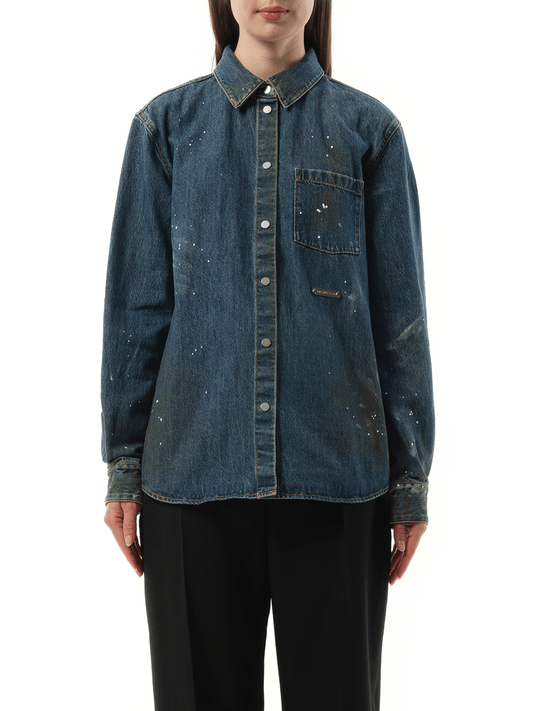 Image of a model wearing Denim. Productname: HELMUT LANG Women Painted Denim Shirt in Mid Indigo colour by brand - HELMUT LANG