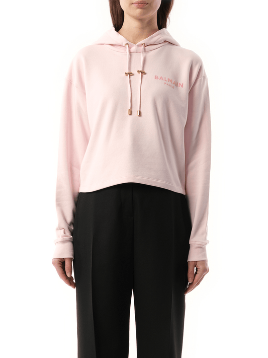 Image of a model wearing Outerwear. Productname: BALMAIN Balmain Flock Detail Cropped Hoodie in PINK colour by brand - BALMAIN
