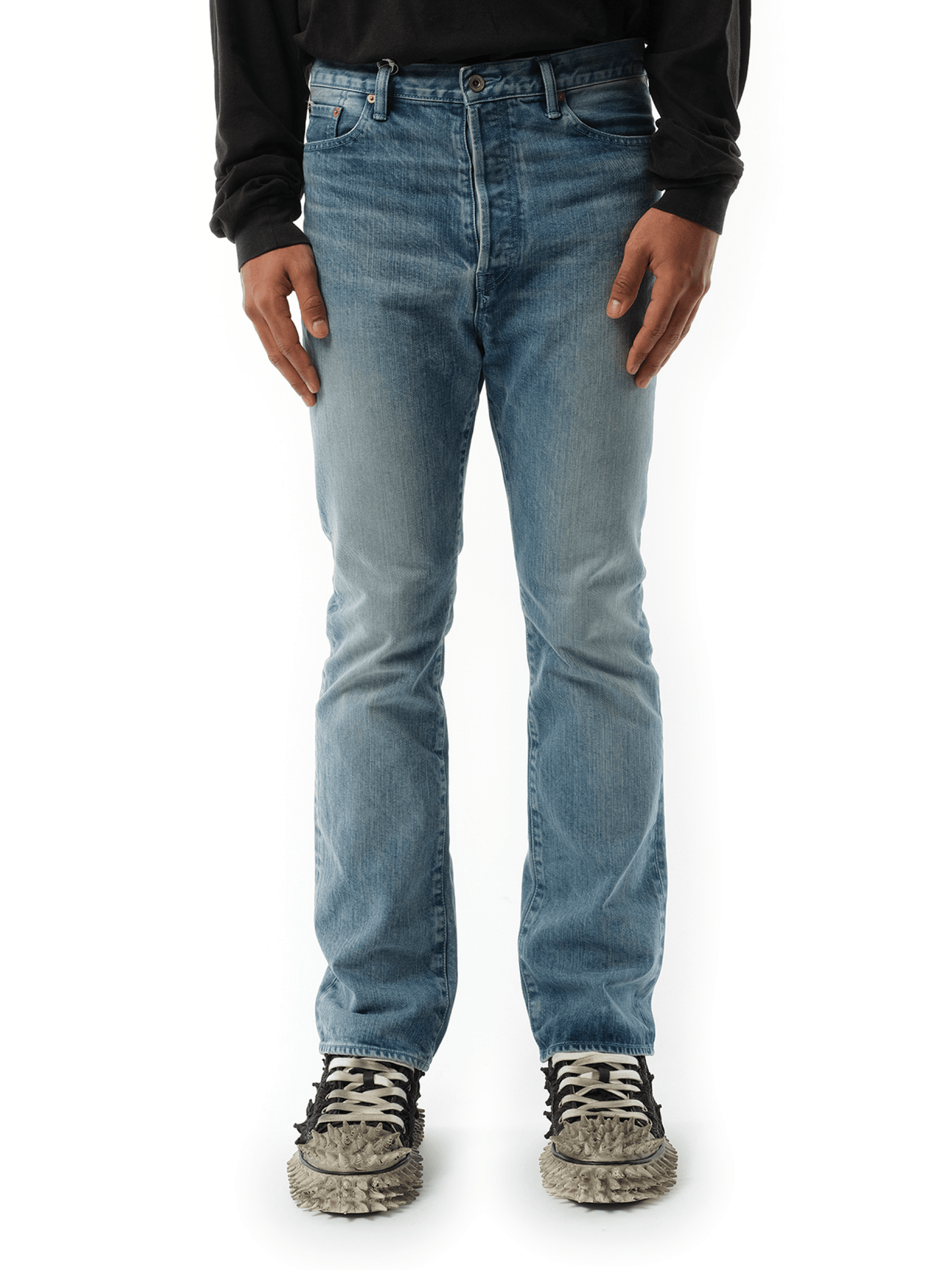 Image of a model wearing Denim. Productname: DOUBLET Care Denim Pants in BLUE colour by brand - DOUBLET