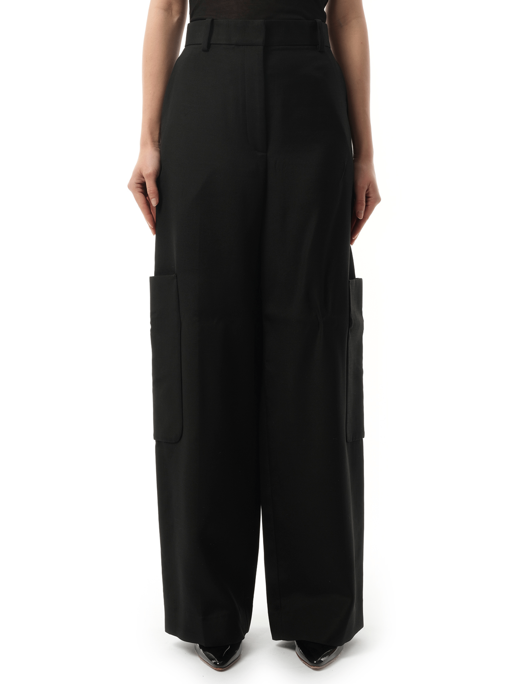 Image of a model wearing Pants. Productname: KHAITE Caiton Pant in Black colour by brand - KHAITE