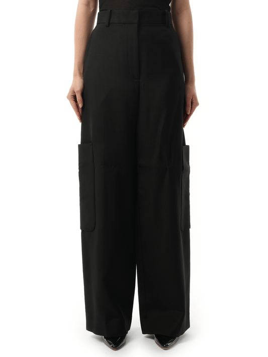Image of a model wearing Pants. Productname: KHAITE Caiton Pant in Black colour by brand - KHAITE